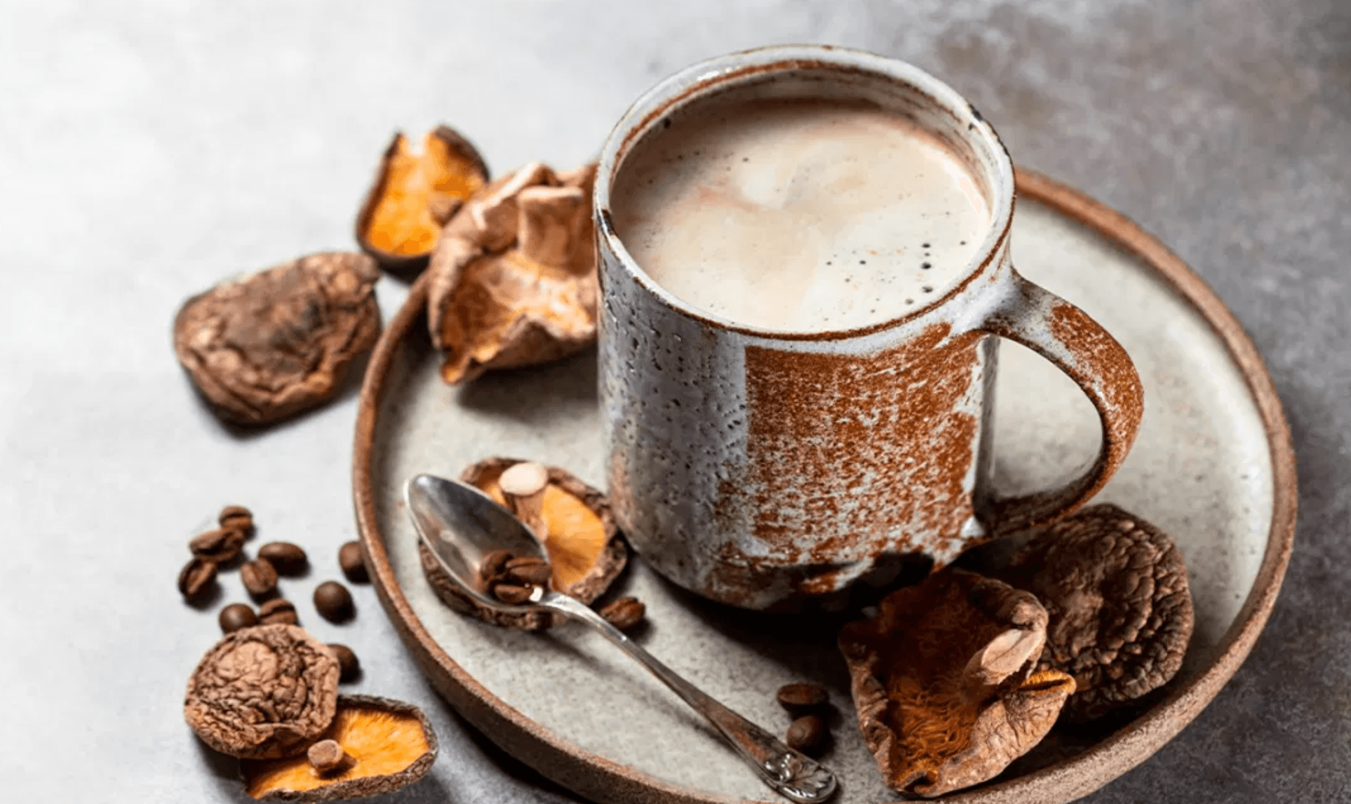 mushroom coffee in a mug with leaves around 